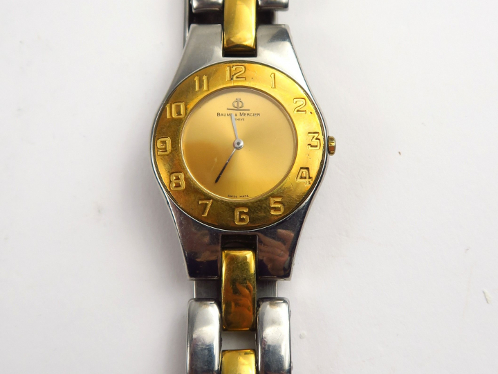 BAUME ET MERCIER. Montre bracelet en acier, deux couleurs