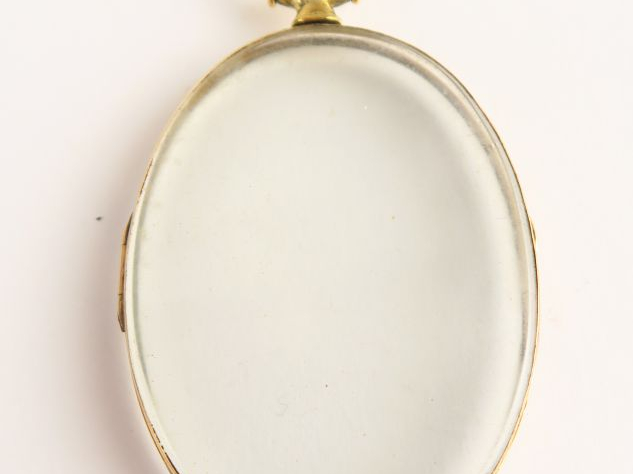 Porte photo en verre, monture en or. Poids tel : 15,3 g