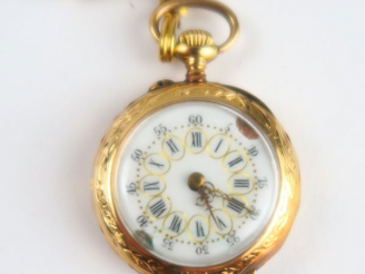 Vente aux enchères 9/ Montre de col en or. Poids tel : 17 g. On y joint une broche en mét