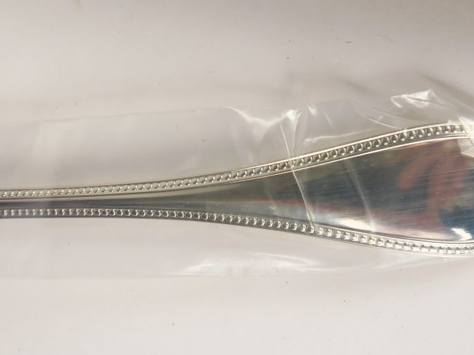 CHRISTOFLE. Dans 8 pochettes, ensemble de couverts comprenant 8 grands