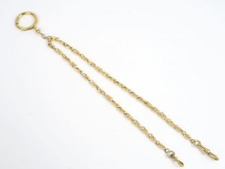 Vente aux enchères Giletière en or, avec ses fermoirs. Poids : 16 g