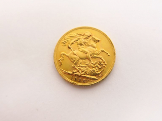 Vente aux enchères Une pièce Georges V en or 1928.  FRAIS ACHETEURS : 5% TTC