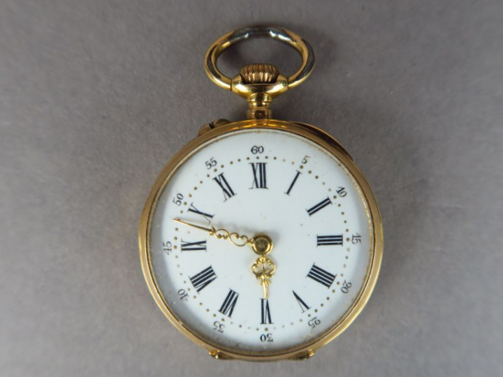 Montre de col en or jaune.  Poids tel. 18,22 g (bélière en métal)