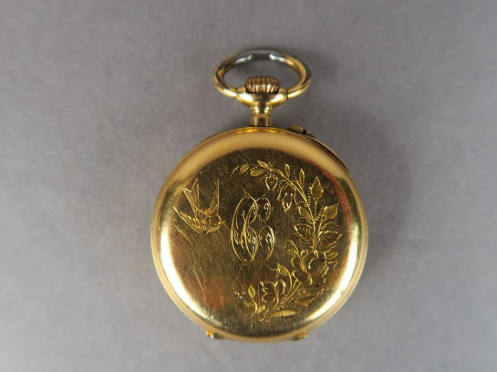 Montre de col en or jaune.  Poids tel. 18,22 g (bélière en métal)