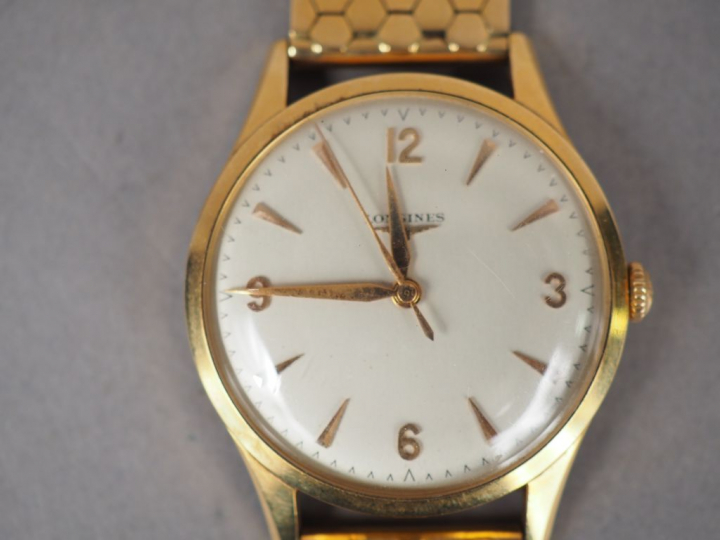 LONGINES.  Montre d'homme, boitier et bracelet or.  Poids tel. 70,06 g