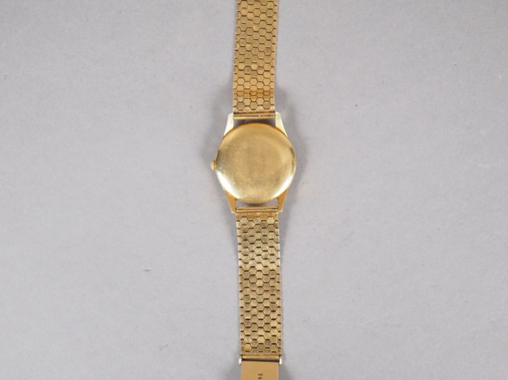 LONGINES.  Montre d'homme, boitier et bracelet or.  Poids tel. 70,06 g