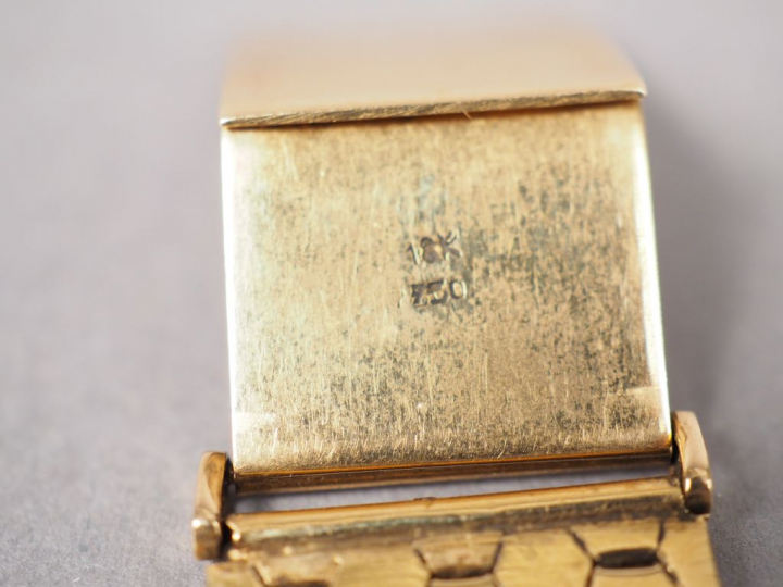 LONGINES.  Montre d'homme, boitier et bracelet or.  Poids tel. 70,06 g