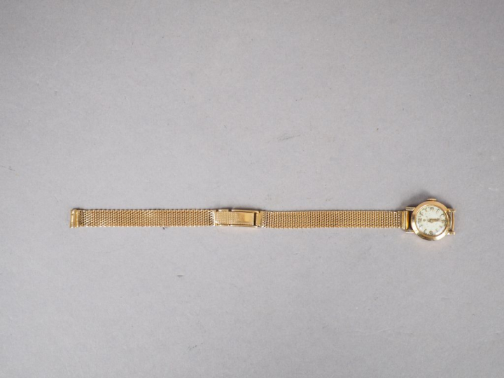 ELECTION.  Montre de dame, boitier et bracelet en or jaune.  Poids tel