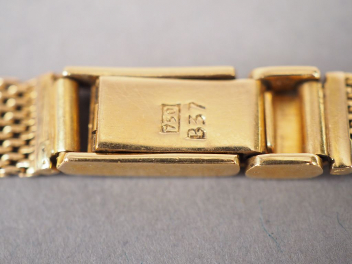 ELECTION.  Montre de dame, boitier et bracelet en or jaune.  Poids tel