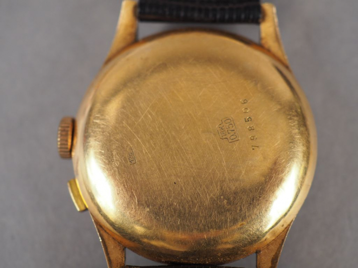 FLOREX. Montre d'homme, boitier en or jaune, bracelet cuir.  Numérotée