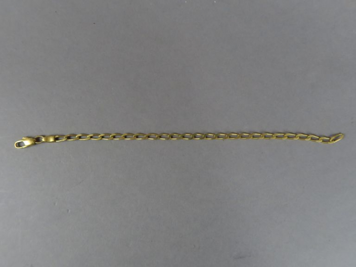 Gourmette en or jaune.  Poids. 9,27 g