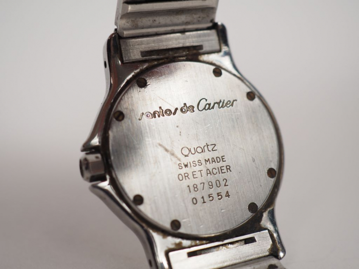 CARTIER.  Montre d’homme, modèle "Santos" en or et acier. Signée. Numé