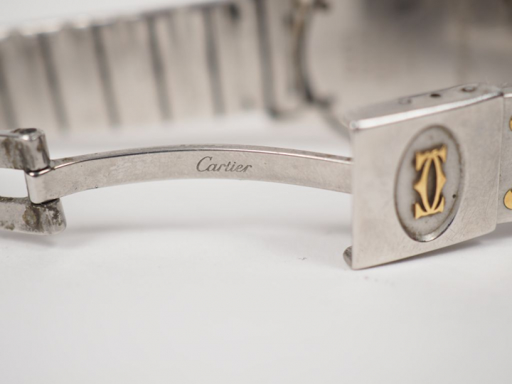 CARTIER.  Montre d’homme, modèle "Santos" en or et acier. Signée. Numé
