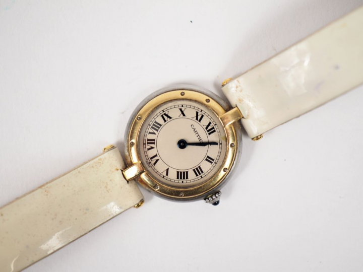 	CARTIER. Montre de dame, modèle "Panthère" en or et acier.  Bracelet 