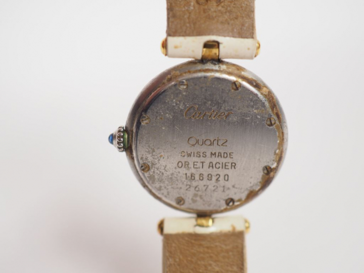 	CARTIER. Montre de dame, modèle "Panthère" en or et acier.  Bracelet 