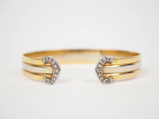 Vente aux enchères 	CARTIER.  Bracelet trois tons d’or et diamants.  Signé. Numéroté 5754