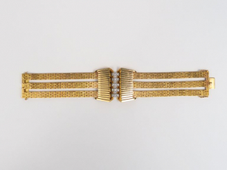 Vente aux enchères Bracelet de style Art déco en or jaune, orné en son centre de quinze p