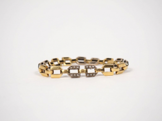 Vente aux enchères 	Bracelet deux tons d’or et diamants. Poids tel. 23,08 g