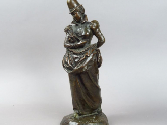 Vente aux enchères E. FREMIET. "Elégante au chiot". Sujet en bronze sculpté à patine brun