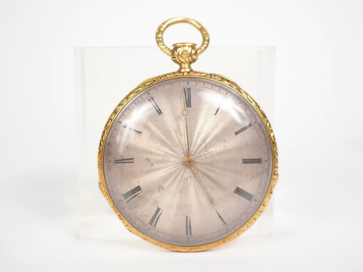 Montre de gousset en or jaune, les bords à décor de rinceaux feuillagé