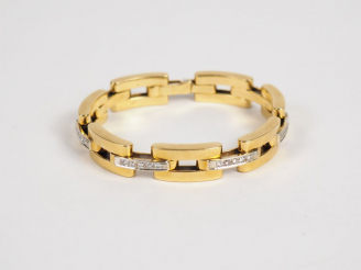 Vente aux enchères Bracelet articulé de style Art déco en or jaune et diamants, maille re