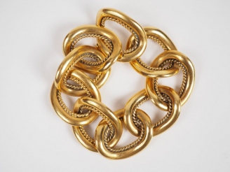 Vente aux enchères Bracelet en or jaune, composé de neuf médaillons.  Long. 19 cm Poids. 