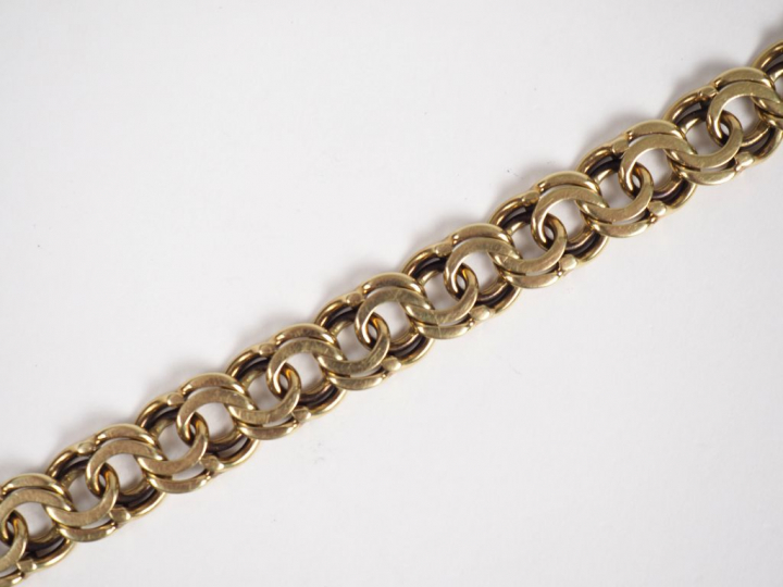 Bracelet souple en or jaune 14k, maille faite de cercles entrelacés. L