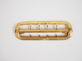 Vente aux enchères Boucle de ceinture en or jaune, à décor de rinceaux feuillagés. Long. 