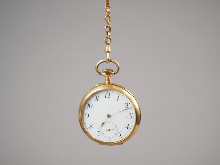 Montre de gousset en or jaune 14K et une giletière en or jaune 18K, ca