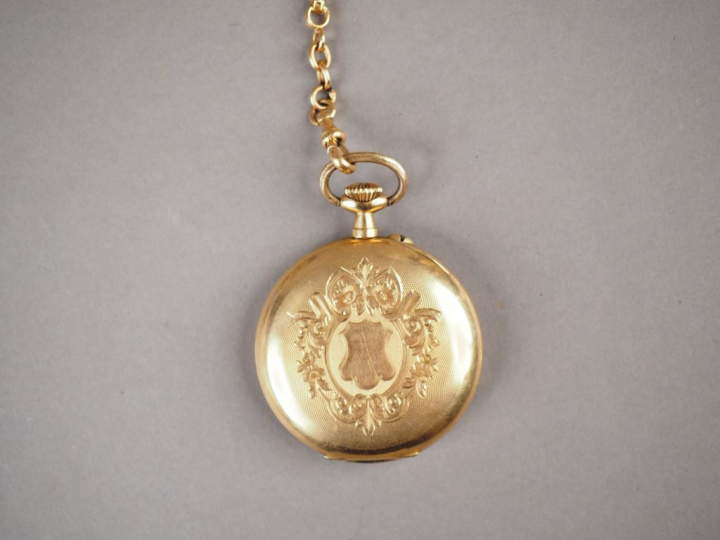 Montre de gousset en or jaune 14K et une giletière en or jaune 18K, ca