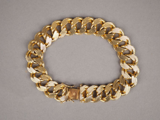 Vente aux enchères Bracelet articulé en or jaune, maille faite de cercles entrelacés. Lon