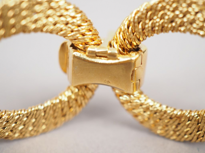 Bracelet articulé en or jaune, maillons ronds tressés et maillons bomb