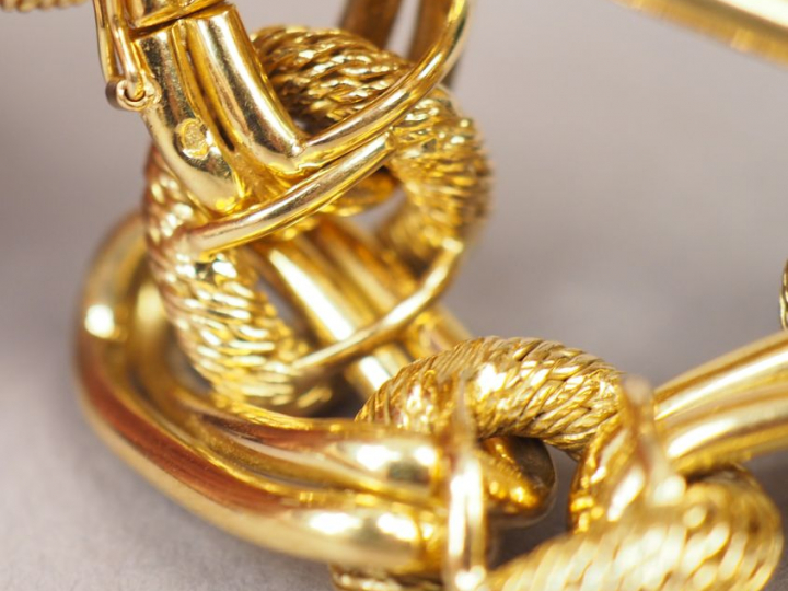 Bracelet articulé en or jaune, maillons ronds tressés et ovales à doub