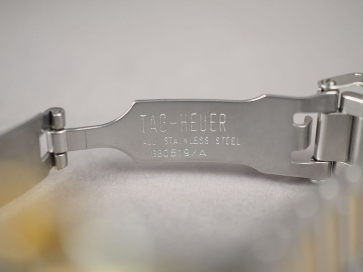 TAG HEUER. Montre de dame en métal et métal doré, modèle "Professional