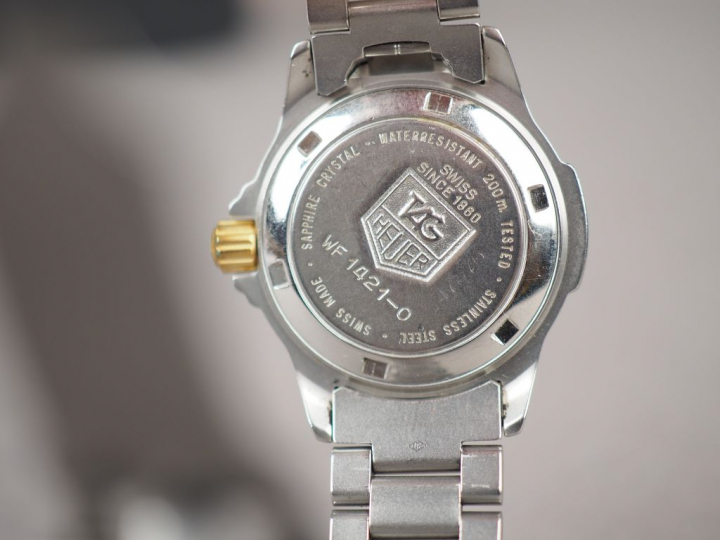 TAG HEUER. Montre de dame en métal et métal doré, modèle "Professional