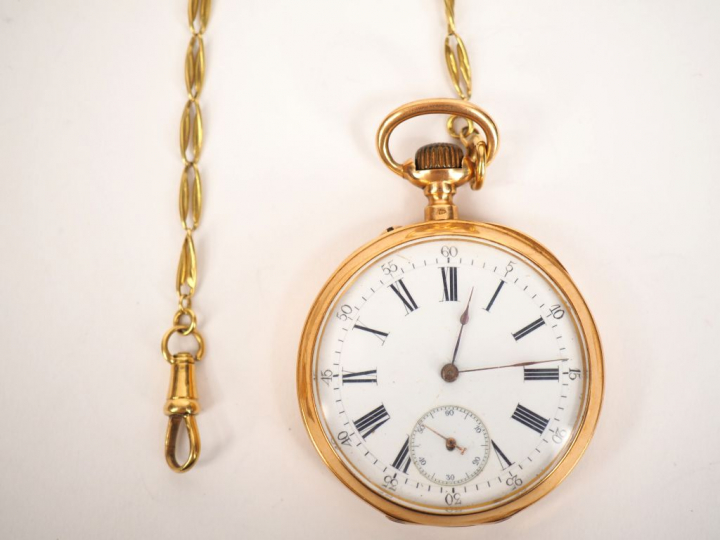 Montre de gousset en or jaune et giletière en or jaune. Cadran blanc à