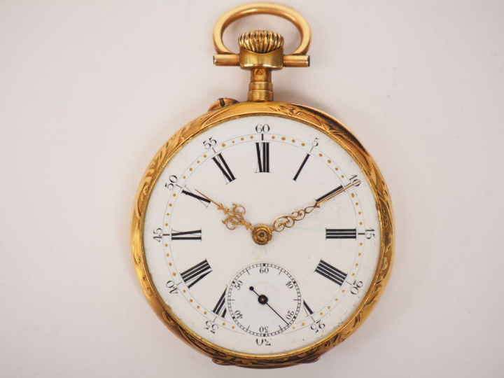 Montre de gousset en or jaune.  Cadran blanc à chiffres arabes pour le