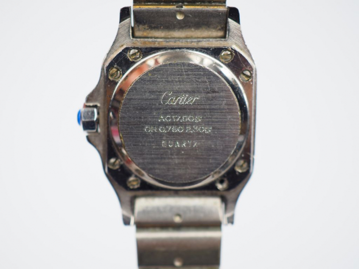 CARTIER. Montre bracelet de dame, modèle Santos, en acier et or jaune.