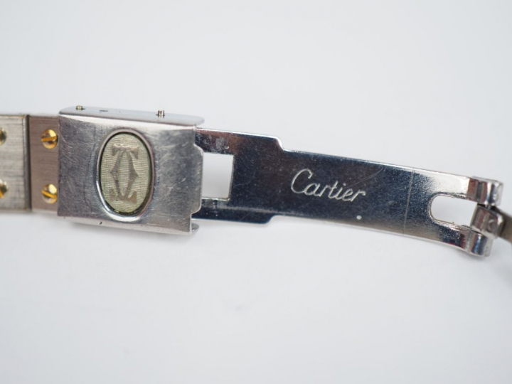 CARTIER. Montre bracelet de dame, modèle Santos, en acier et or jaune.