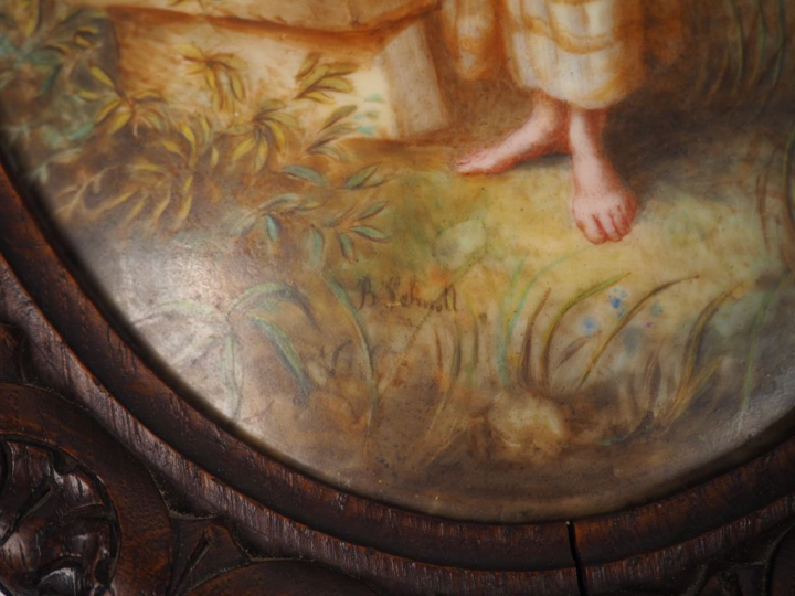 B. SCHMOLL "Jeunes paysannes" Paire de plaques ovales en porcelaine.  