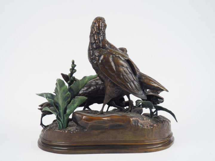 DUBUCAND. "Couple de bécasses et leurs petits" Groupe en bronze à pati