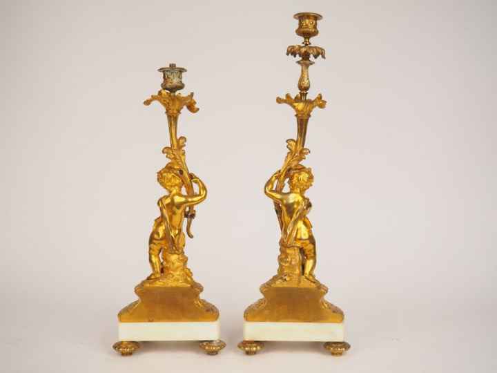 	Paire de bougeoirs Napoléon III de style Louis XVI en bronze doré et 