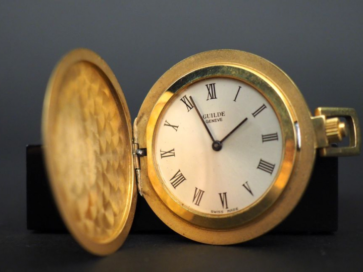 Montre de gousset savonnette extra plate en or. Guilde Genève. Poids t