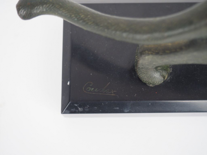 MICHEL DECOUX. "Panthère". Sujet en bronze à patine verte. Signé sur l