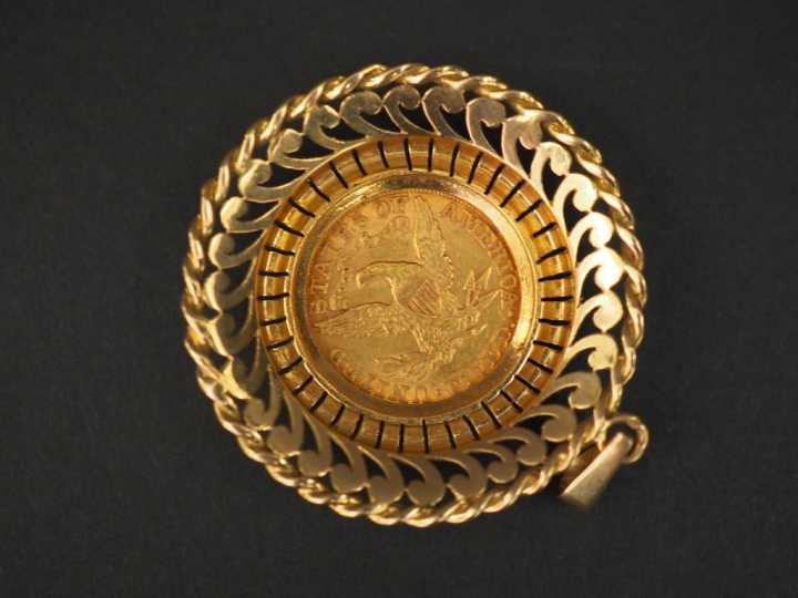 Pendentif en or pièce de 5 dollars montée. Poids : 21,30 g