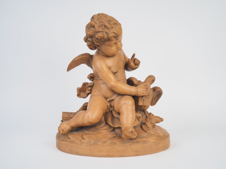 PIGALLE (d'après). "Amour à l'oiseau". Sculpture en terre cuite. Signé