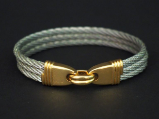 Vente aux enchères FRED. Bracelet "force 10", signé. Poids : 45 g