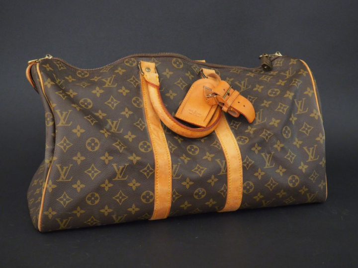 VUITTON. Sac de voyage en toile Monogram., parements et poignées arron