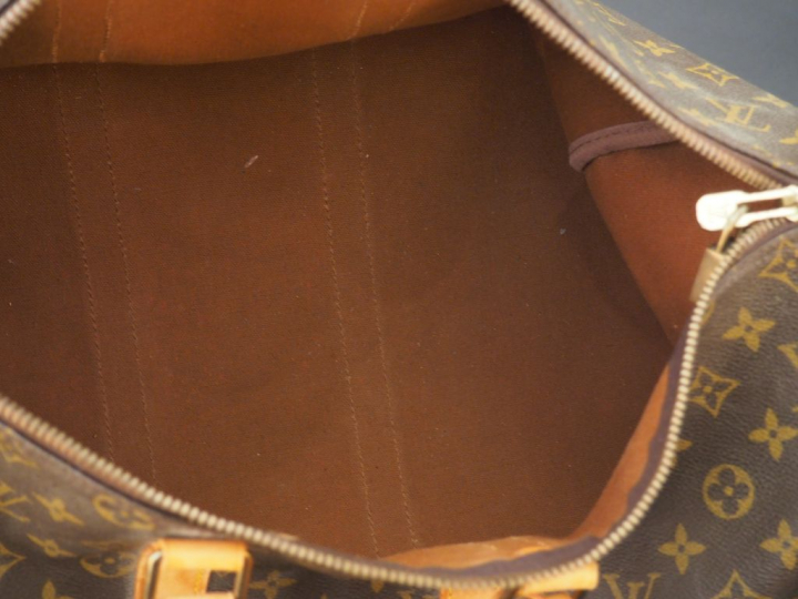 VUITTON. Sac de voyage en toile Monogram., parements et poignées arron