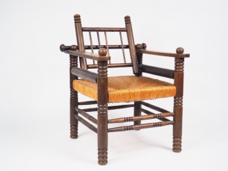 Vente aux enchères Charles DUDOUYT.  Grand fauteuil paillé, dossier basculant. (Manque un